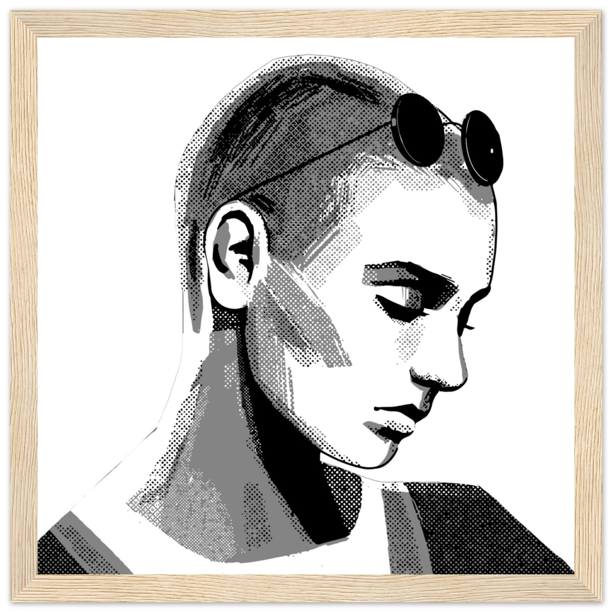 Framed Sinéad O'Connor portrait in a light oak frame, downcast eyes and sunglasses on her head