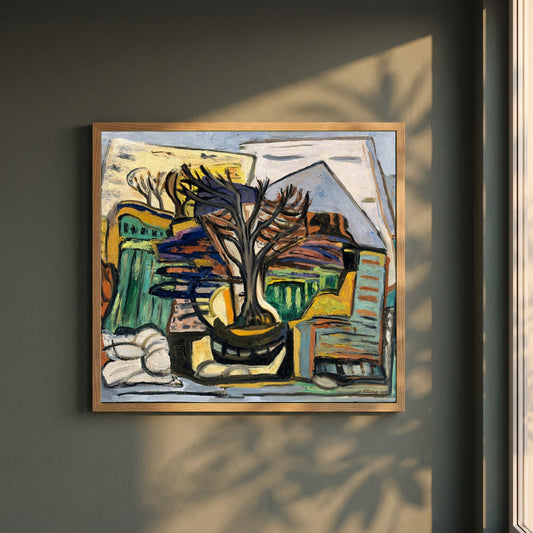A Landscape with a Tree framed print in a natural oak frame on a dark green wall beside a window, dappled plant shadow