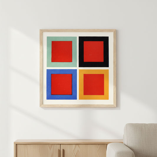 James Ward Tone and Hue print in an oak frame above a wooden sideboard beside an armchair