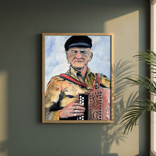 Patsy Dan Rogers Framed Art Print King of Tory Island framed print in a natural oak frame on a dark green wall beside a window, dappled plant shadow