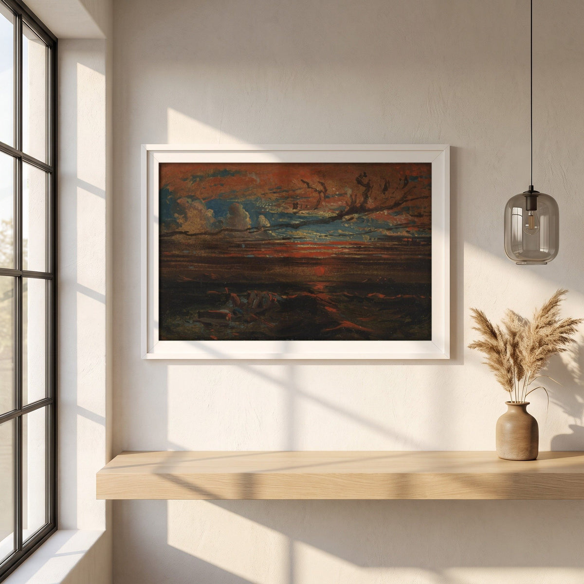 Sunset at Sea After a Storm framed print in a white frame on a plaster wall above an oak worktop in a bright Scandinavian kitchen