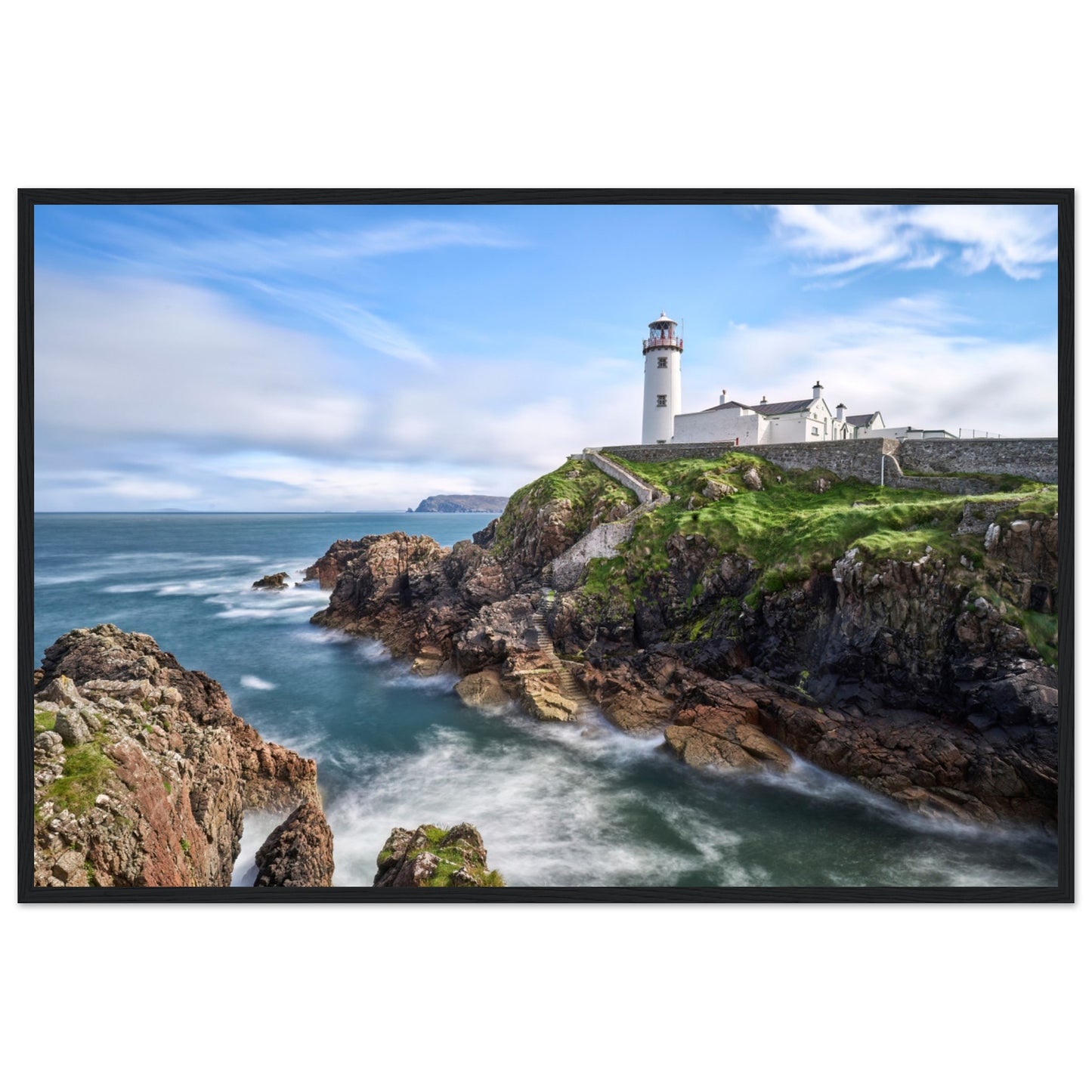 Capture the breathtaking beauty of Fanad Head Lighthouse in Co. Donegal, Ireland with our framed print. This captivating piece beautifully portrays the iconic landmark, offering a slice of Ireland&#39;s rugged coastal charm for your home decor.