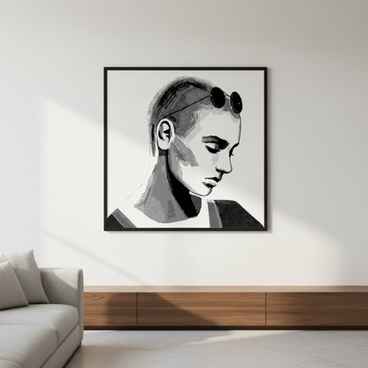 Sinéad O'Connor portrait print in a black frame above a low wooden console beside a grey sofa