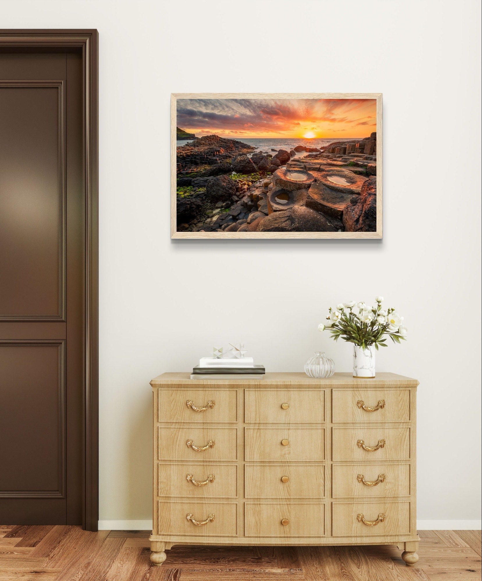 The framed design adds a touch of sophistication, making it a perfect addition to your home or office decor. Immerse yourself in the tranquility of this coastal landscape every day with our Sunset at Giant's Causeway framed art print