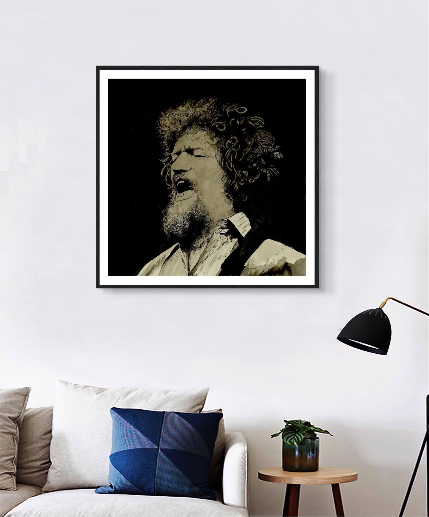 Framed art print of Luke Kelly by Irish artist Mullan. The piece captures Kelly singing On Raglan Road, showcasing his emotive expression. High-quality framing adds elegance, making it a perfect tribute to the legendary singer and a beautiful addition to any home.