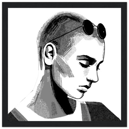 Black and white Sinéad O'Connor portrait in a black frame, shaved head with sunglasses pushed up, front view