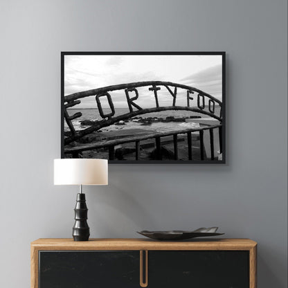Vibrant coastal scene capturing the beauty of The Forty Foot in Dublin, featuring the iconic Martello tower and swimmers against a backdrop of serene waters.