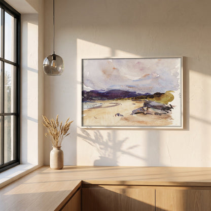 A Bay and Distant Mountains framed print in a white frame on a plaster wall above an oak worktop in a bright Scandinavian kitchen