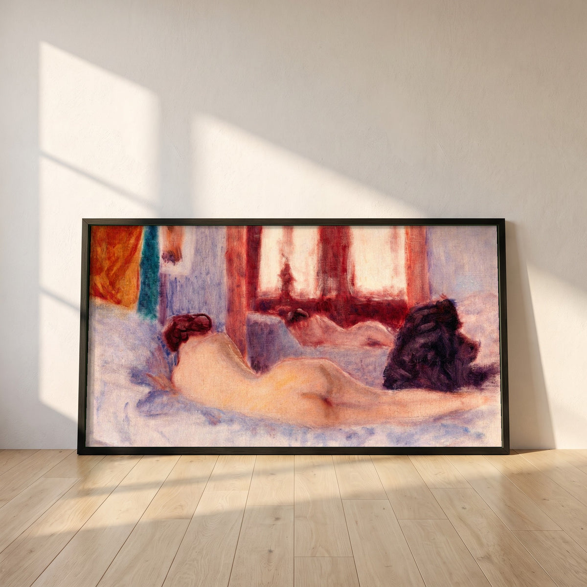 A Reclining Figure before a Mirror framed print in a black frame leaning against a white plaster wall on oak floorboards in morning light