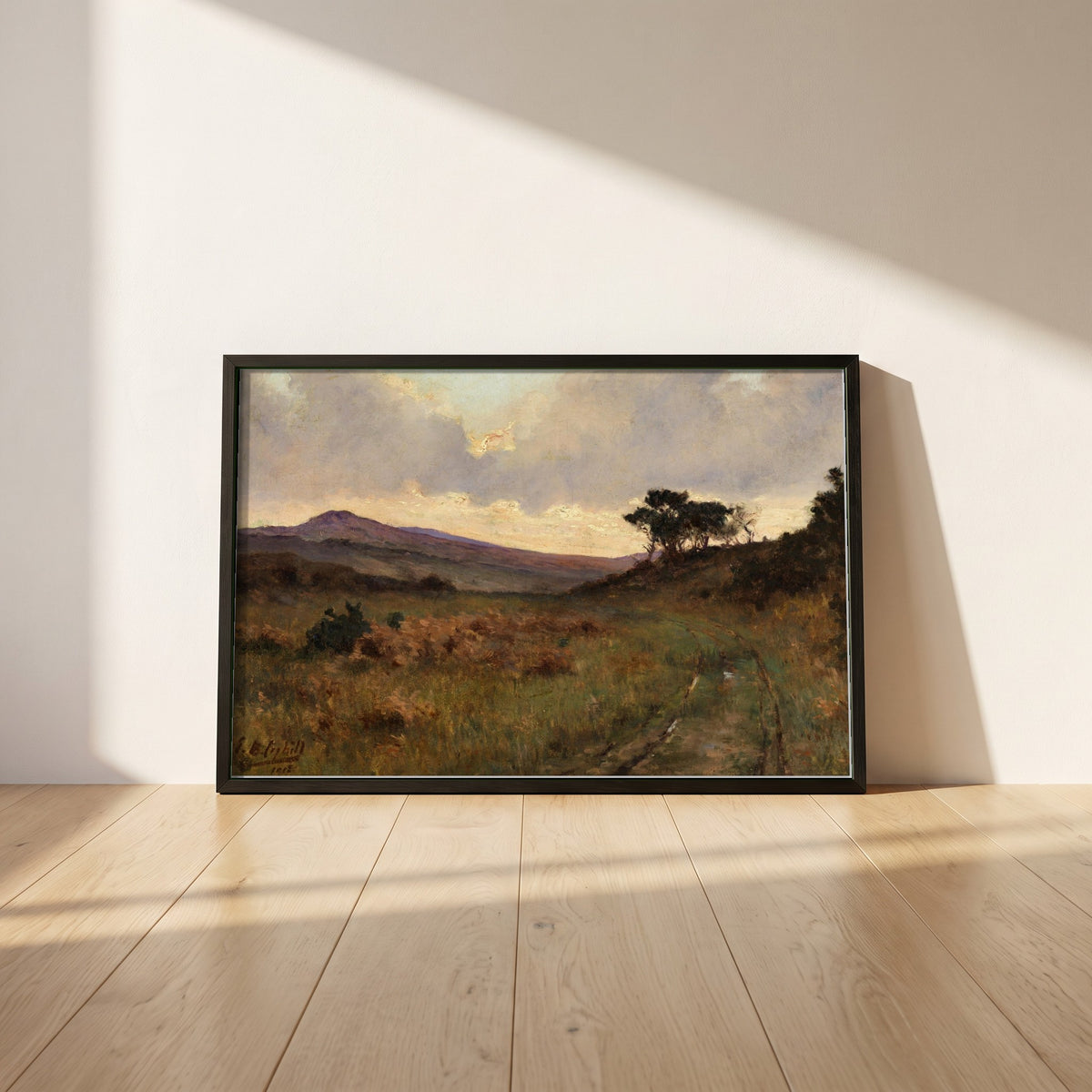 Castletownshend, County Cork framed print in a black frame leaning against a white plaster wall on oak floorboards in morning light