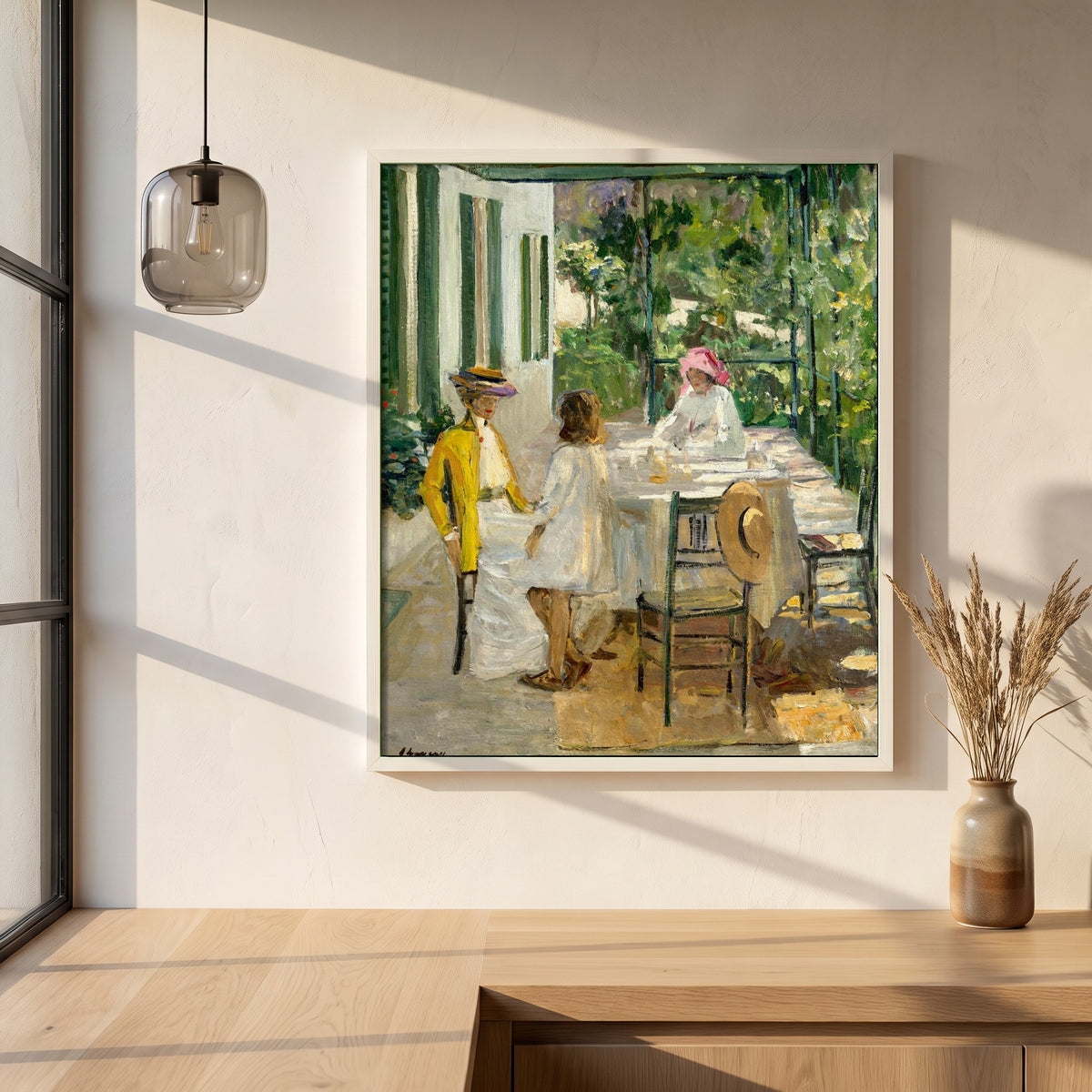 After Breakfast, Tangier framed print in a white frame on a plaster wall above an oak worktop in a bright Scandinavian kitchen