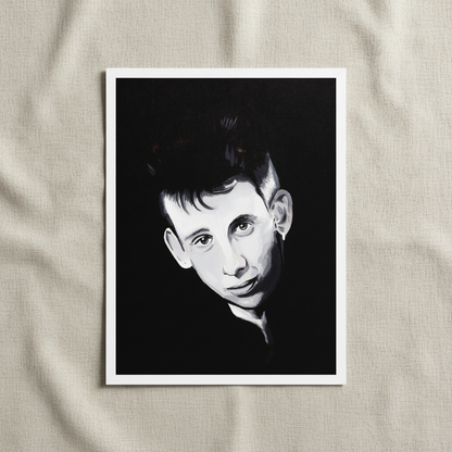 Shane MacGowan portrait unframed print with a white border lying on cream linen