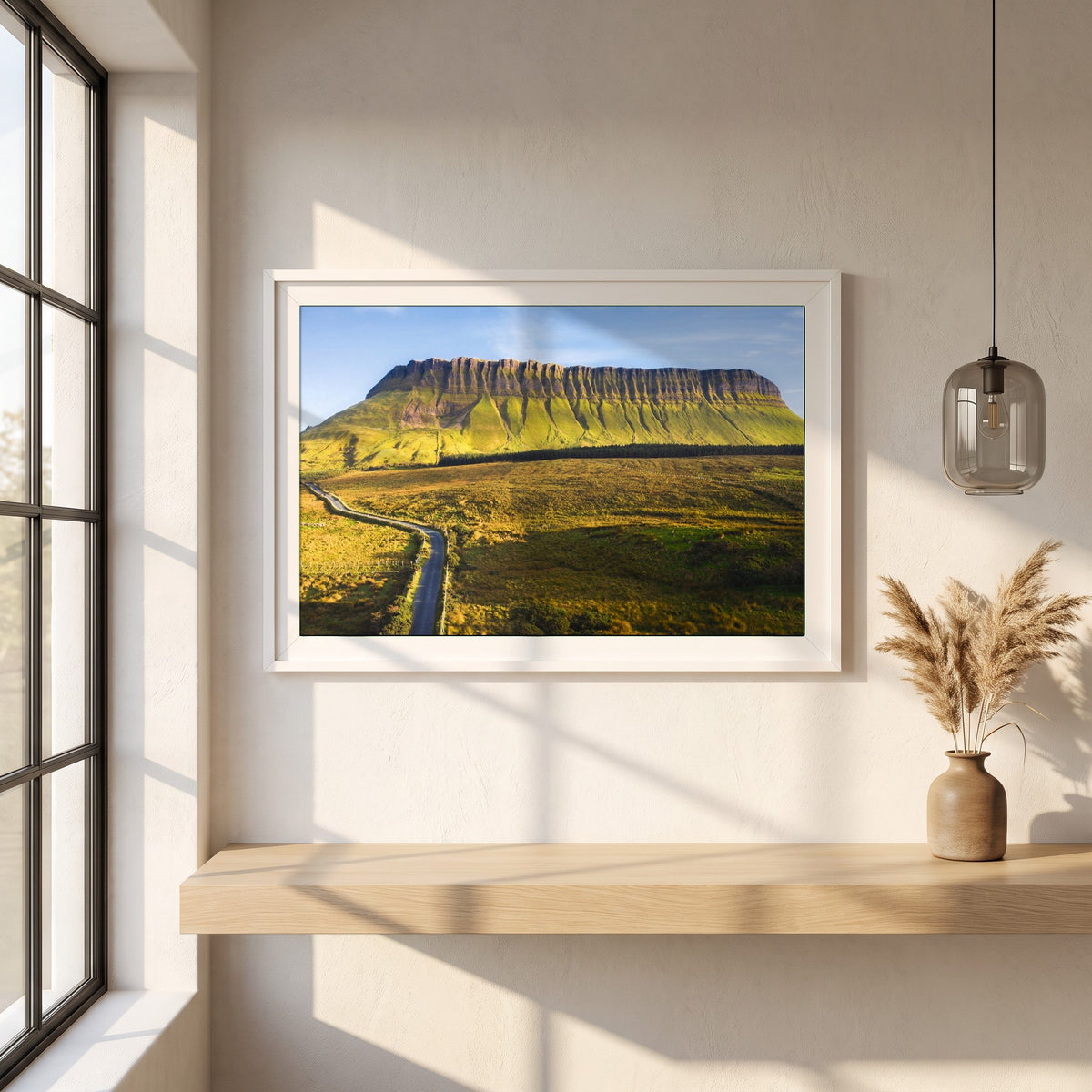 Benbulben, Sligo framed print in a white frame on a plaster wall above an oak worktop in a bright Scandinavian kitchen