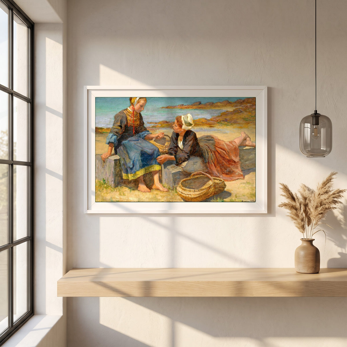 Breton Girls On a Beach By Irish Artist Aloysius O'Kelly framed print in a white frame on a plaster wall above an oak worktop in a bright Scandinavian kitchen