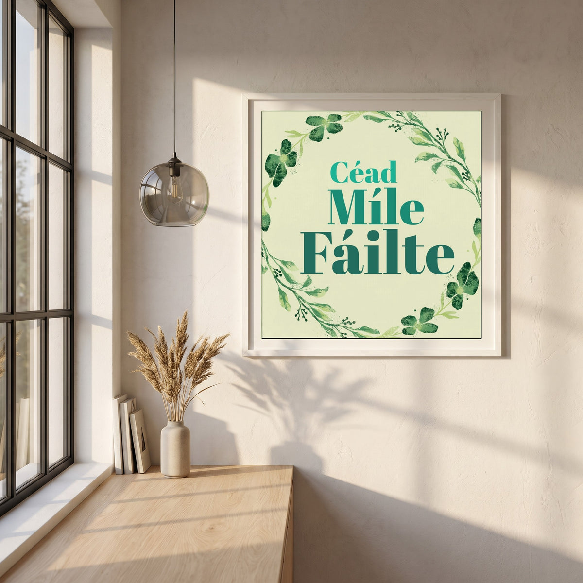 Céad Míle Fáilte framed print in a white frame on a plaster wall above an oak worktop in a bright Scandinavian kitchen