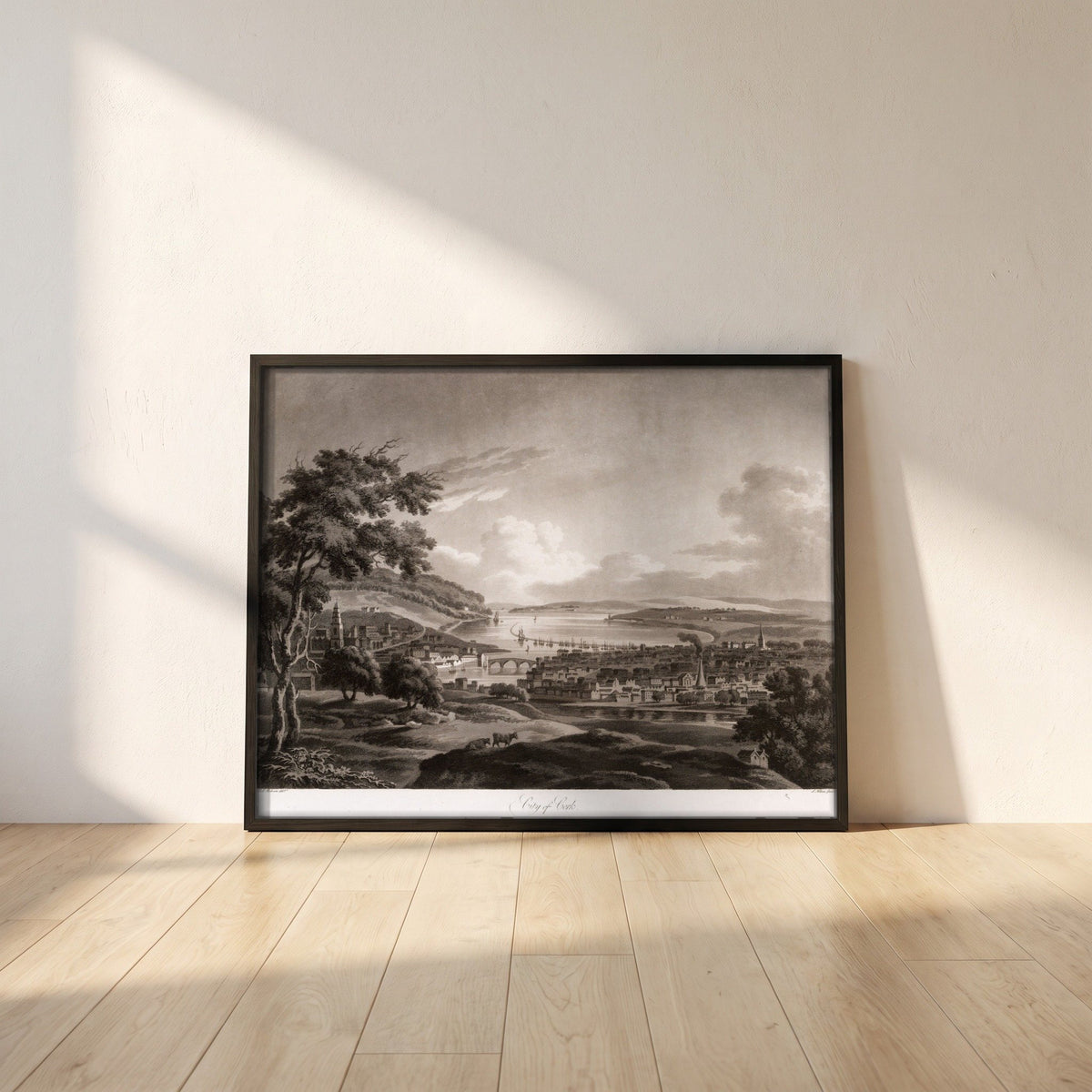 City of Cork by Thomas Sautelle Roberts Art Print framed print in a black frame leaning against a white plaster wall on oak floorboards in morning light