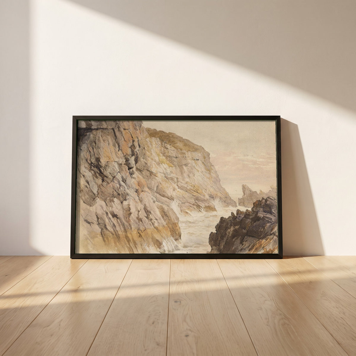 Cliffs at Howth, Dublin framed print in a black frame leaning against a white plaster wall on oak floorboards in morning light