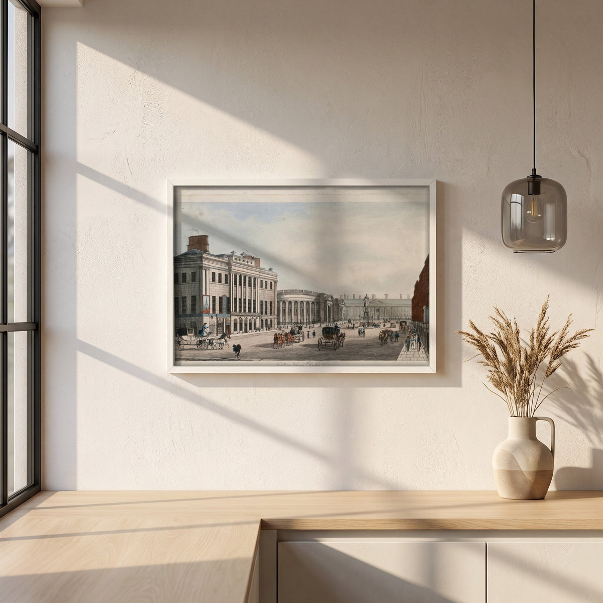 College Green, Dublin framed print in a white frame on a plaster wall above an oak worktop in a bright Scandinavian kitchen