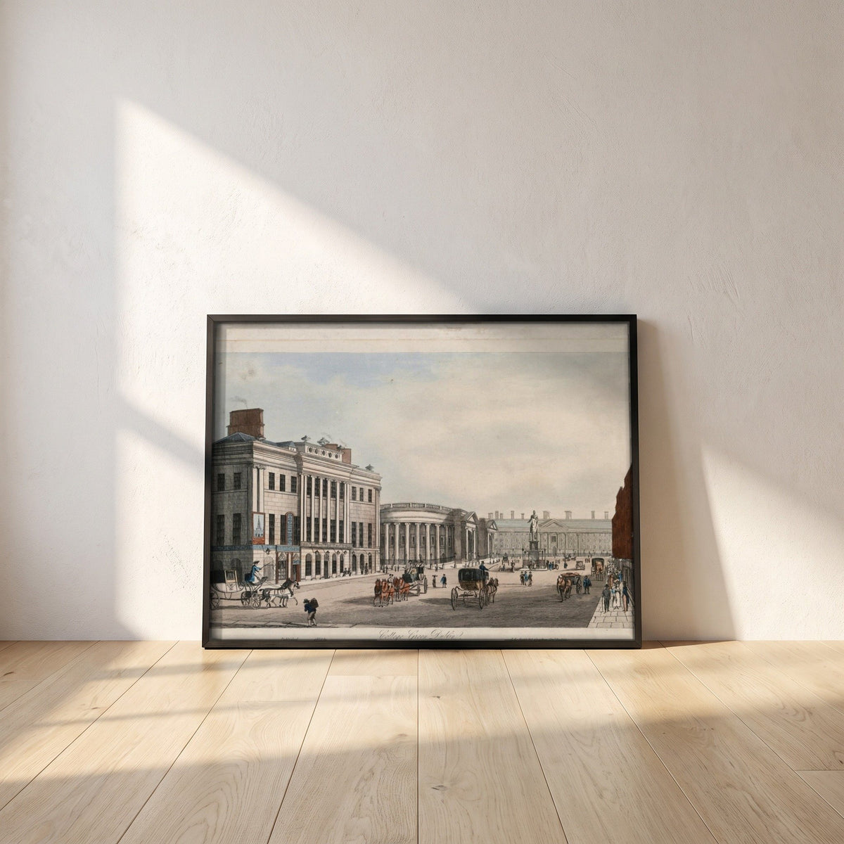 College Green, Dublin framed print in a black frame leaning against a white plaster wall on oak floorboards in morning light