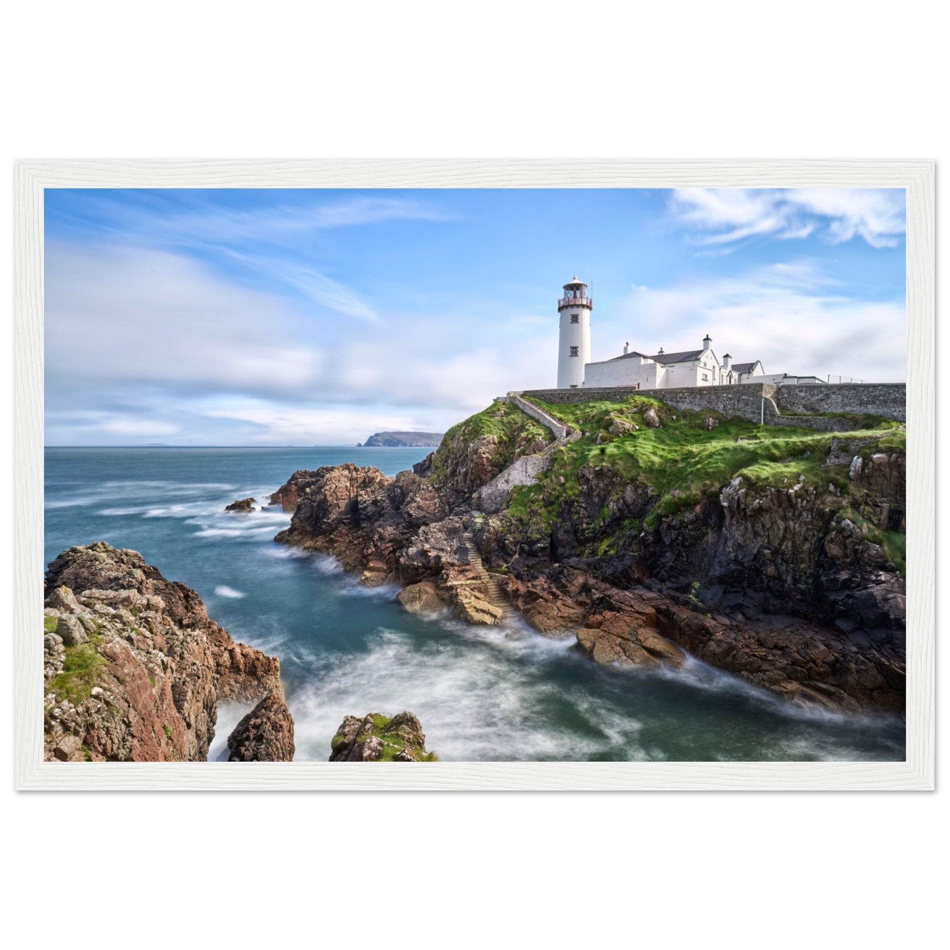 Capture the breathtaking beauty of Fanad Head Lighthouse in Co. Donegal, Ireland with our framed print. This captivating piece beautifully portrays the iconic landmark, offering a slice of Ireland&#39;s rugged coastal charm for your home decor.