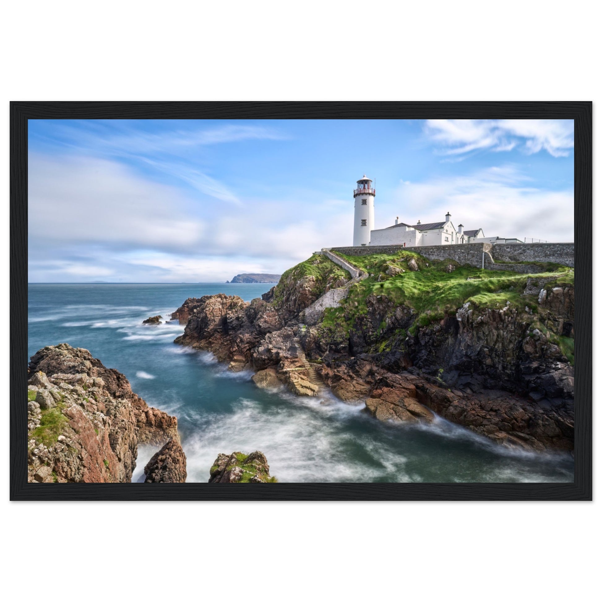 Capture the breathtaking beauty of Fanad Head Lighthouse in Co. Donegal, Ireland with our framed print. This captivating piece beautifully portrays the iconic landmark, offering a slice of Ireland&#39;s rugged coastal charm for your home decor.