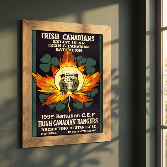 Enlist in an Irish & Canadian Battalion (1915) framed print in a natural oak frame on a dark green wall beside a window, dappled plant shadow