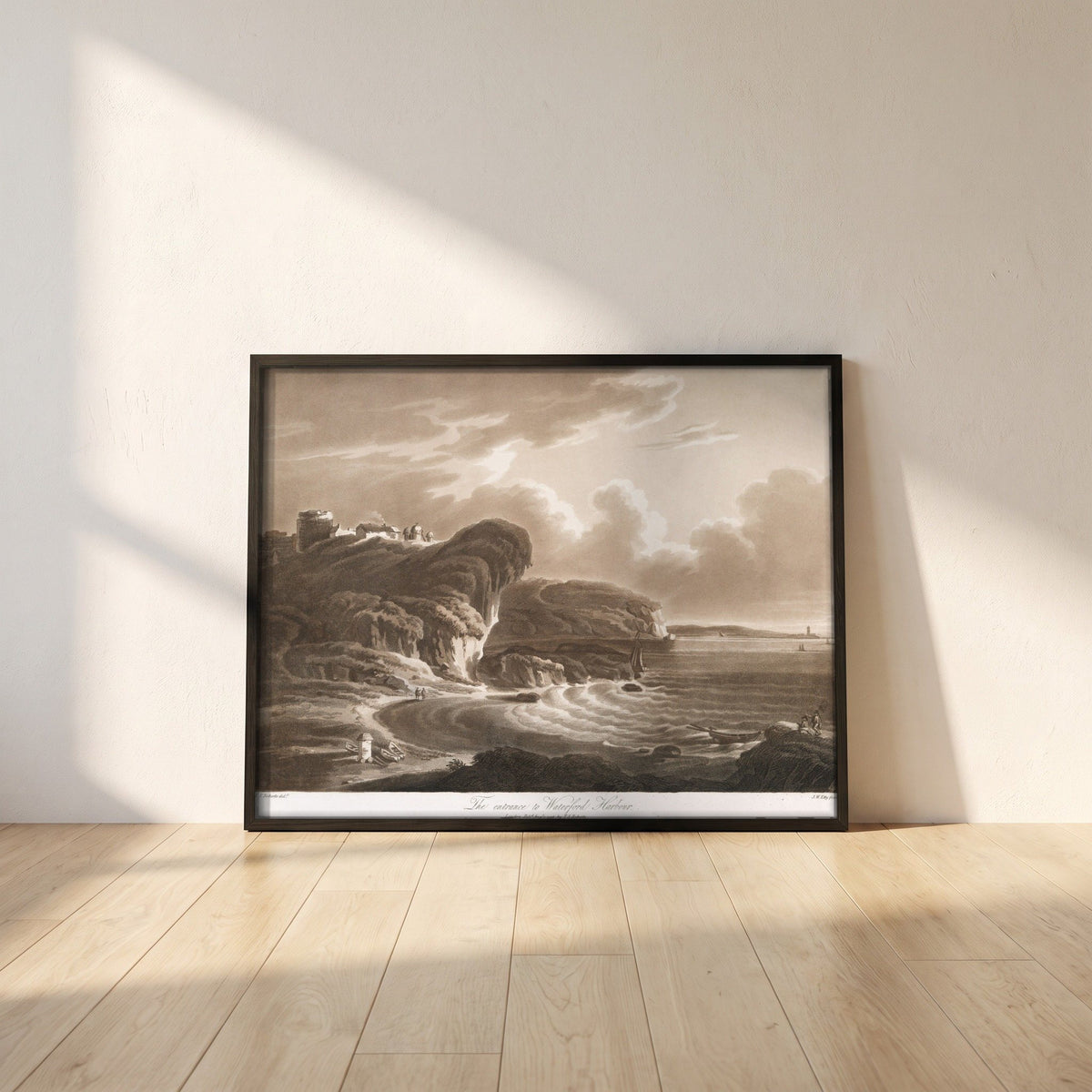 The Entrance to Waterford Harbour by Thomas Sautelle Roberts Art Print framed print in a black frame leaning against a white plaster wall on oak floorboards in morning light