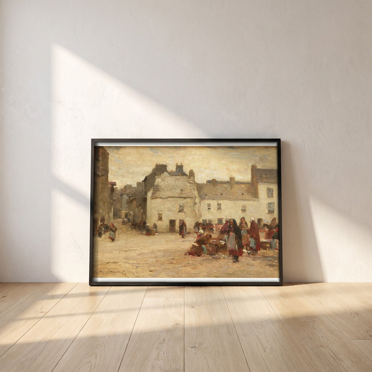 Galway Market Scene by Walter Osborne framed print in a black frame leaning against a white plaster wall on oak floorboards in morning light
