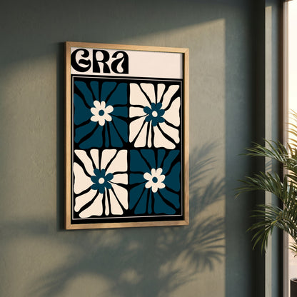 Grá framed print in a natural oak frame on a dark green wall beside a window, dappled plant shadow