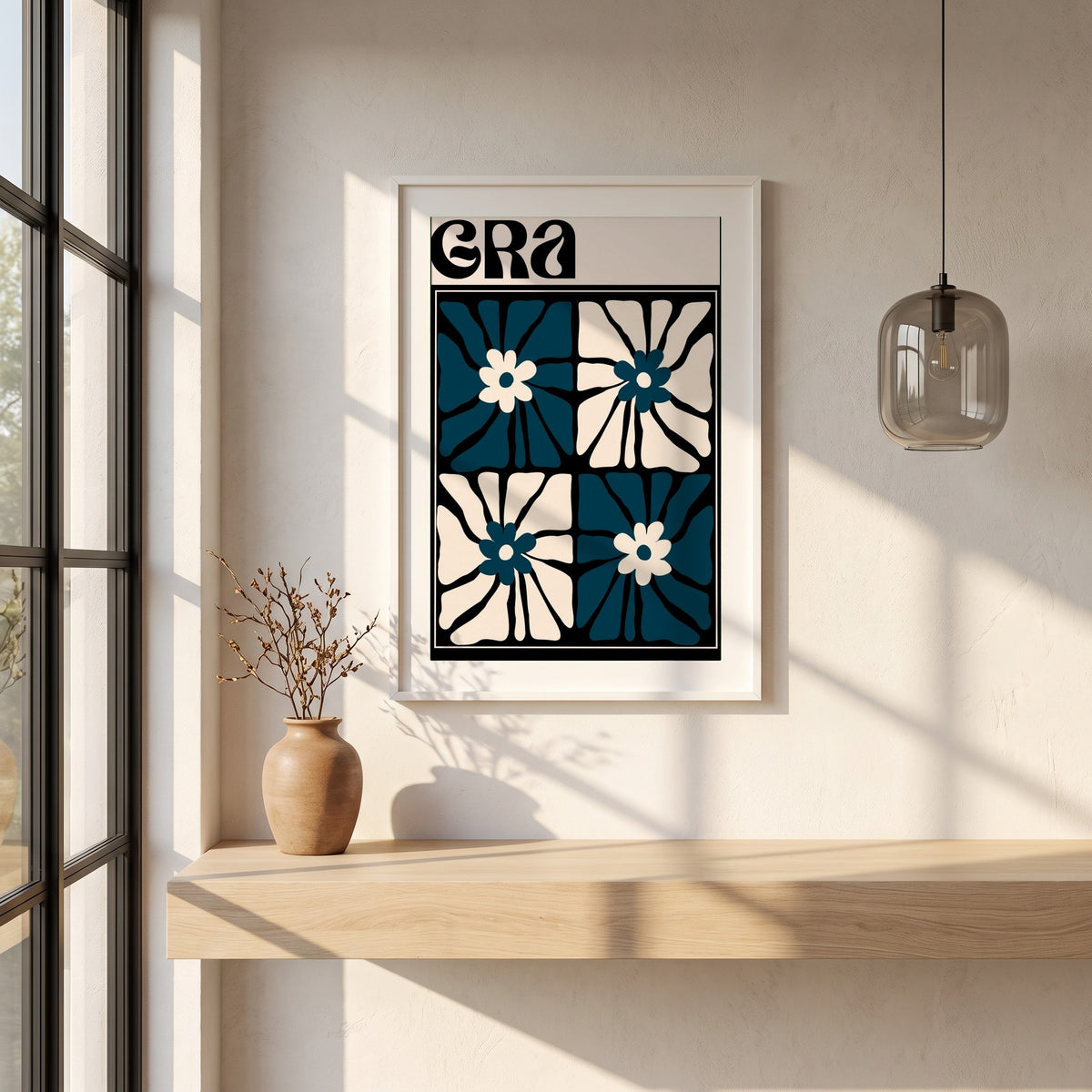 Grá framed print in a white frame on a plaster wall above an oak worktop in a bright Scandinavian kitchen
