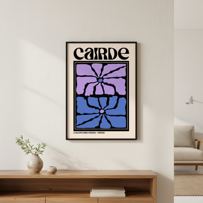Cairde (Friends) Irish language print in a black frame above a wooden sideboard with a vase