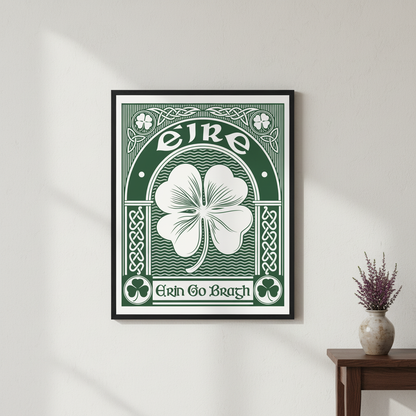 Erin Go Bragh shamrock print in a black frame on a white wall above a side table