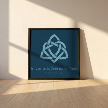 Is fearr an tsláinte ná na táinte framed print in a black frame leaning against a white plaster wall on oak floorboards in morning light