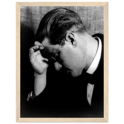 James Joyce portrait photo in profile wearing glasses, print in a natural oak frame with white border