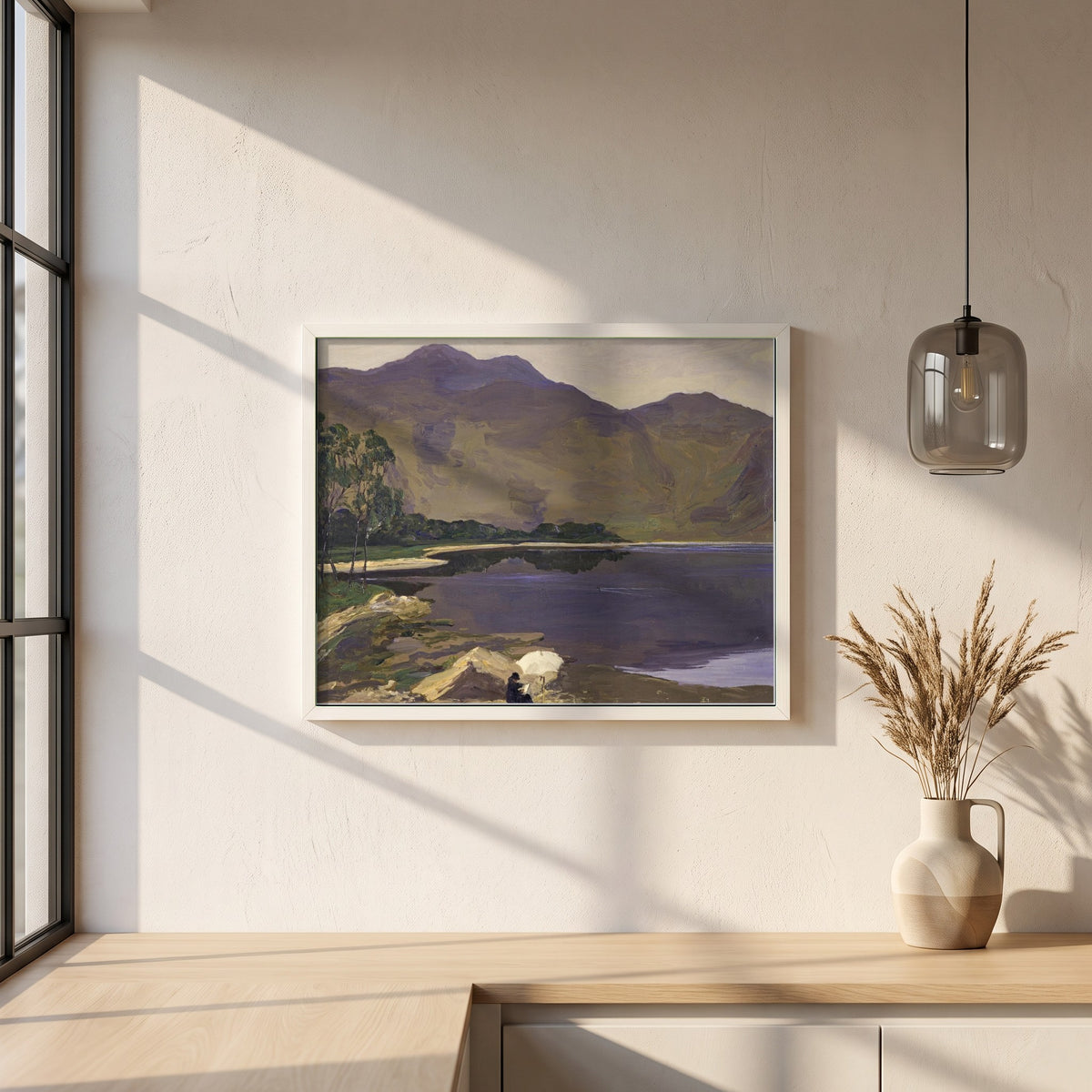 Loch Katrine framed print in a white frame on a plaster wall above an oak worktop in a bright Scandinavian kitchen