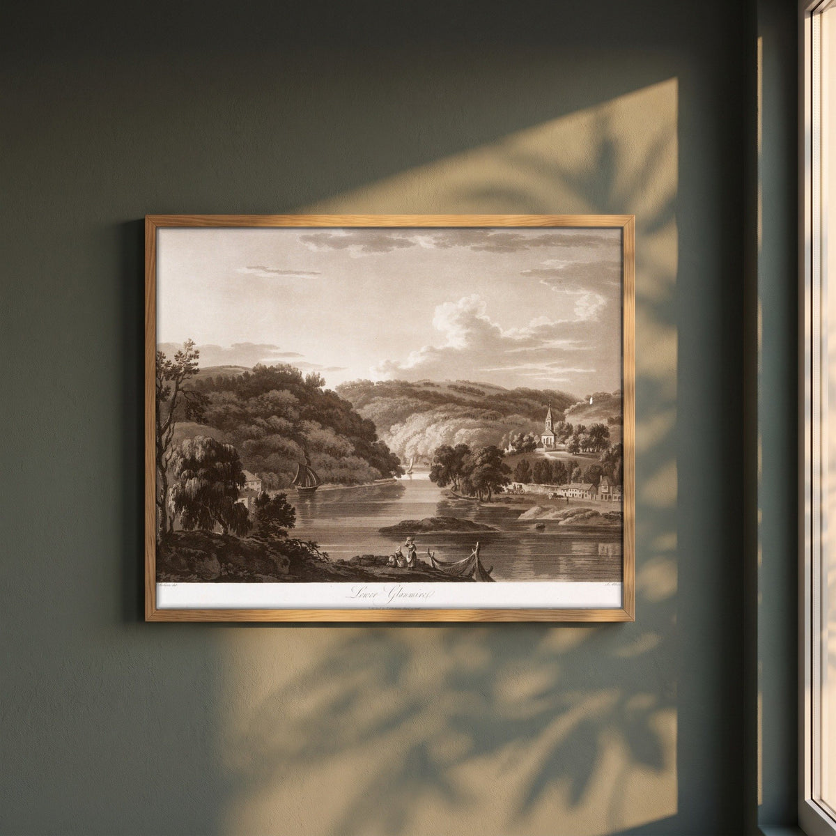 Lower Glanmire by Thomas Sautelle Roberts Art Print framed print in a natural oak frame on a dark green wall beside a window, dappled plant shadow