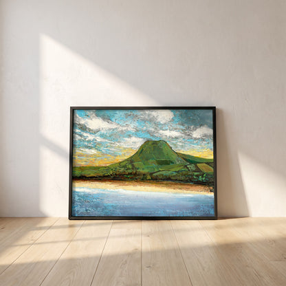 Lurig Mountain at Sunset framed print in a black frame leaning against a white plaster wall on oak floorboards in morning light