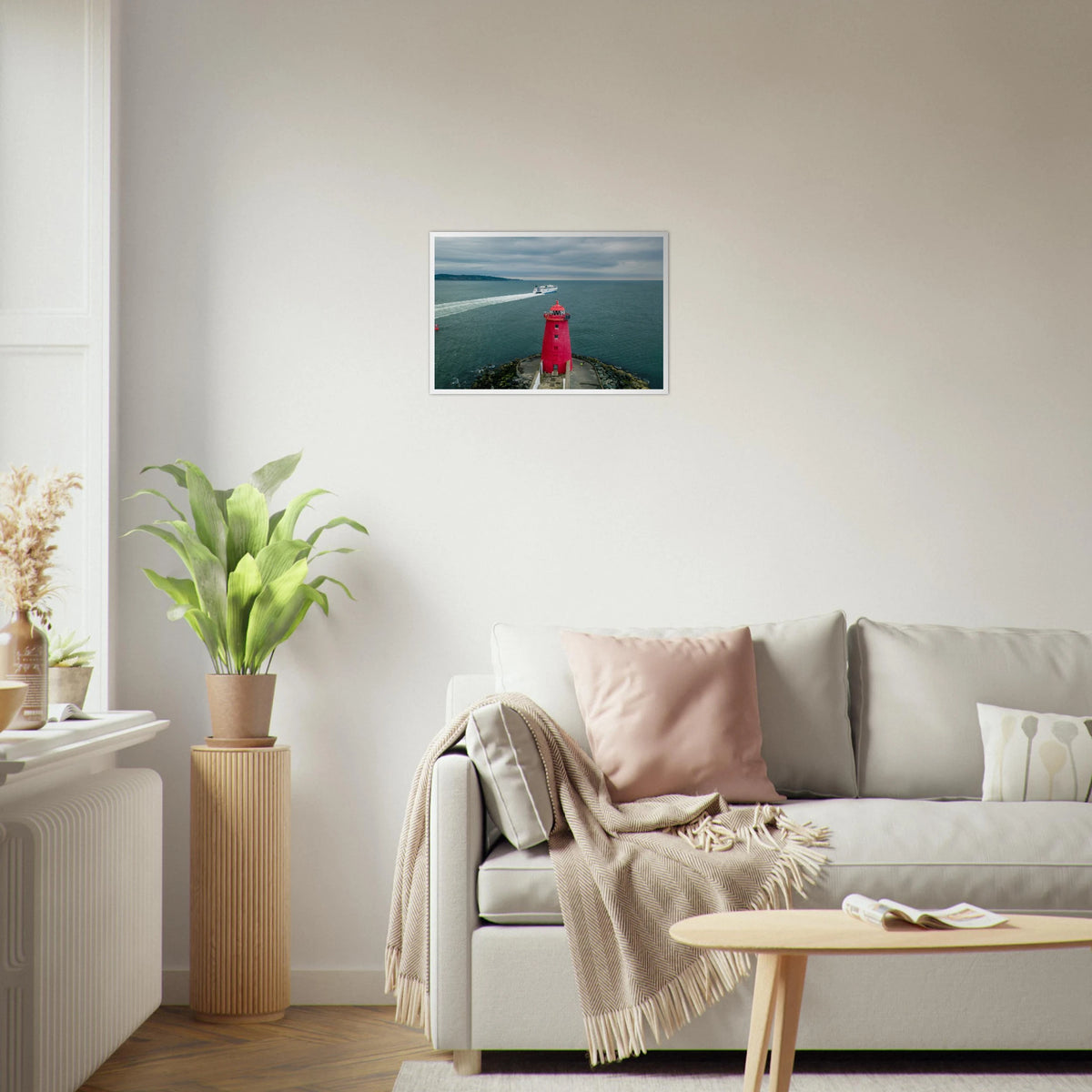 Poolbeg Lighthouse, Dublin Bay framed print above a cream sofa and round coffee table