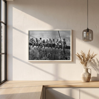 Lunch Atop a Skyscraper framed print in a white frame on a plaster wall above an oak worktop in a bright Scandinavian kitchen