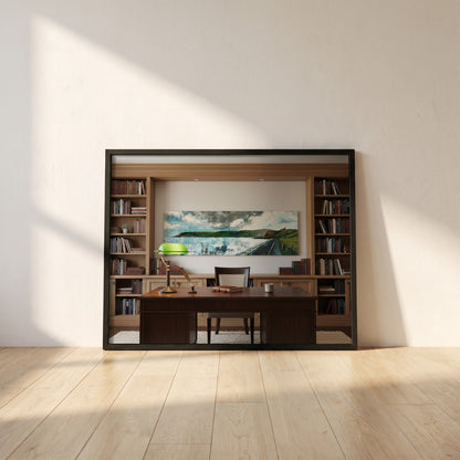 Red Bay, Cushendall framed print in a black frame leaning against a white plaster wall on oak floorboards in morning light