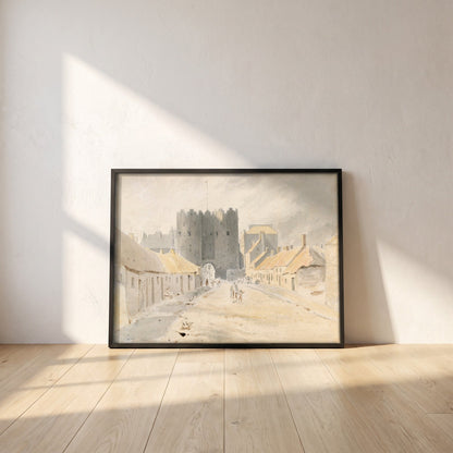 Saint Lawrence's Gate, Drogheda (1819) framed print in a black frame leaning against a white plaster wall on oak floorboards in morning light