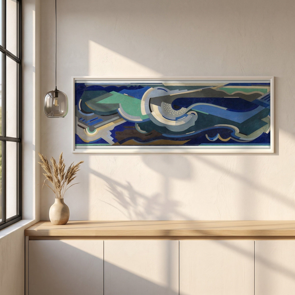 A Composition, Sea Rhythm framed print in a white frame on a plaster wall above an oak worktop in a bright Scandinavian kitchen