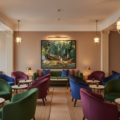 The Path by the River by John Lavery framed print in a hotel lounge with velvet armchairs