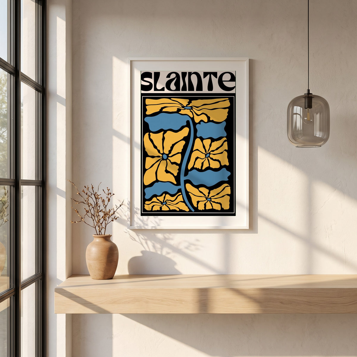 Sláinte framed print in a white frame on a plaster wall above an oak worktop in a bright Scandinavian kitchen