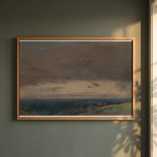 Stormy Clouds at Sunrise framed print in a natural oak frame on a dark green wall beside a window, dappled plant shadow