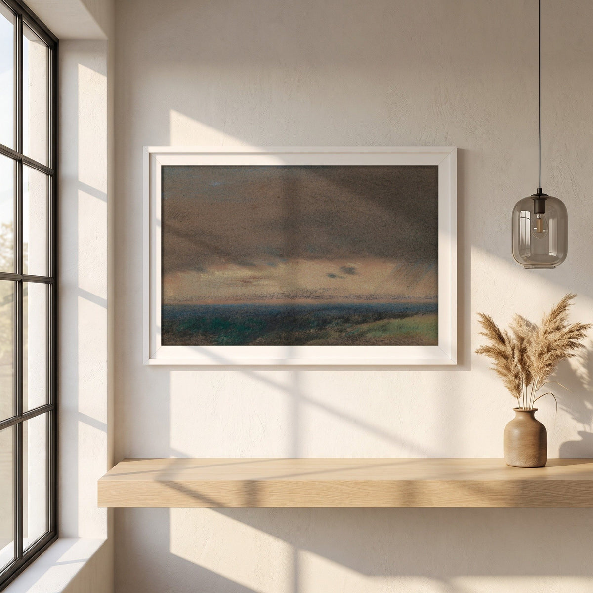Stormy Clouds at Sunrise framed print in a white frame on a plaster wall above an oak worktop in a bright Scandinavian kitchen