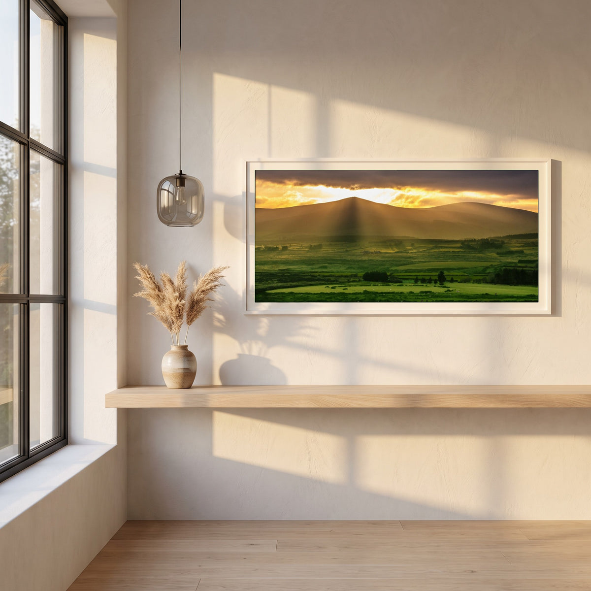 Sugarloaf Mountain, Wicklow framed print in a white frame on a plaster wall above an oak worktop in a bright Scandinavian kitchen