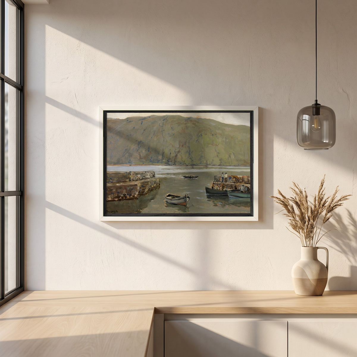 The Harbour, Leenane framed print in a white frame on a plaster wall above an oak worktop in a bright Scandinavian kitchen