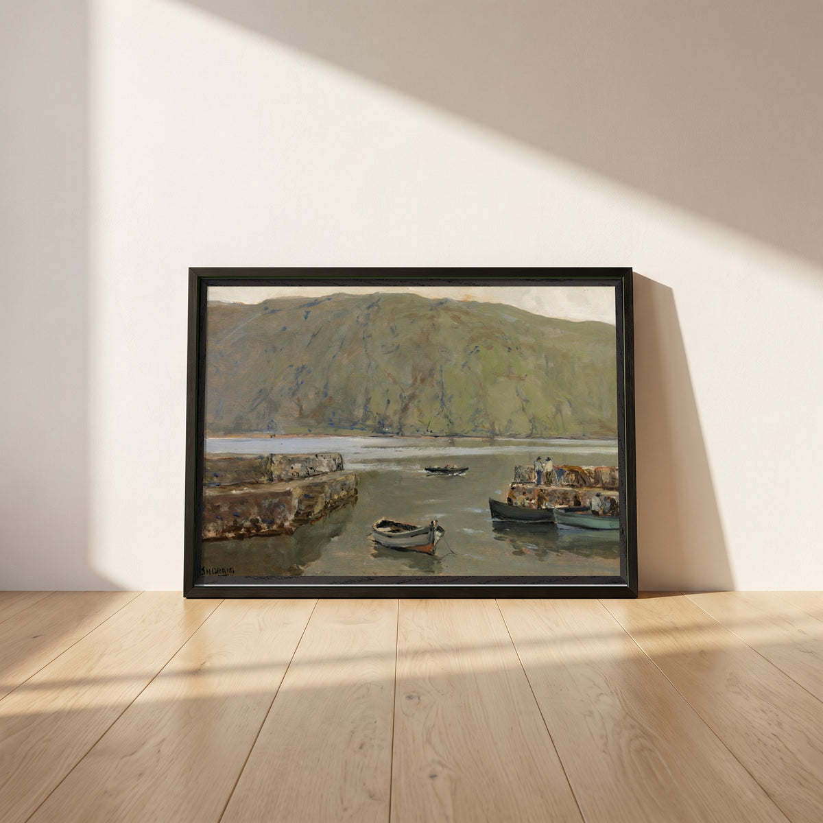 The Harbour, Leenane framed print in a black frame leaning against a white plaster wall on oak floorboards in morning light