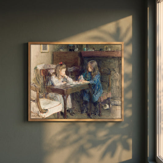The House Builders framed print in a natural oak frame on a dark green wall beside a window, dappled plant shadow